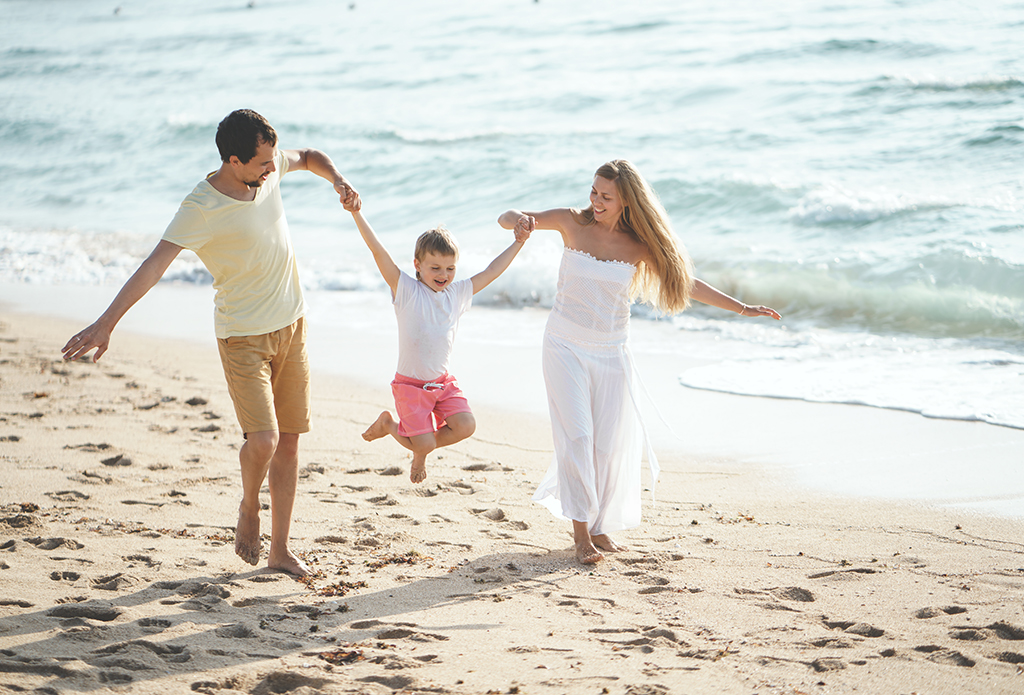 Playing family on the beach